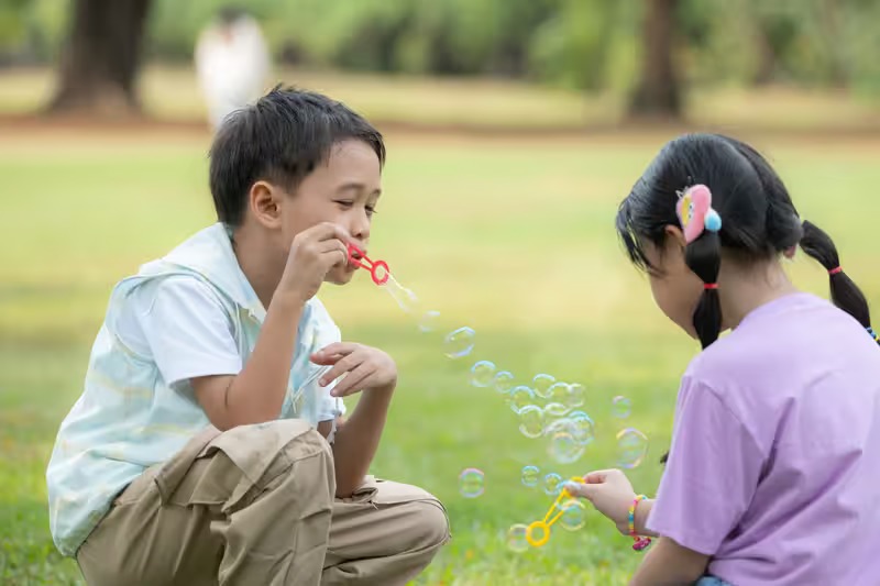 How do resident camp activities promote social and emotional development?